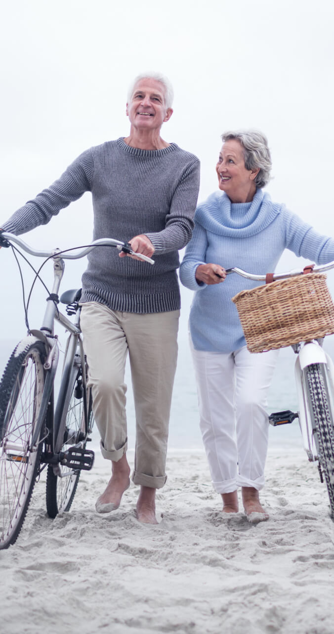 senior couple biking