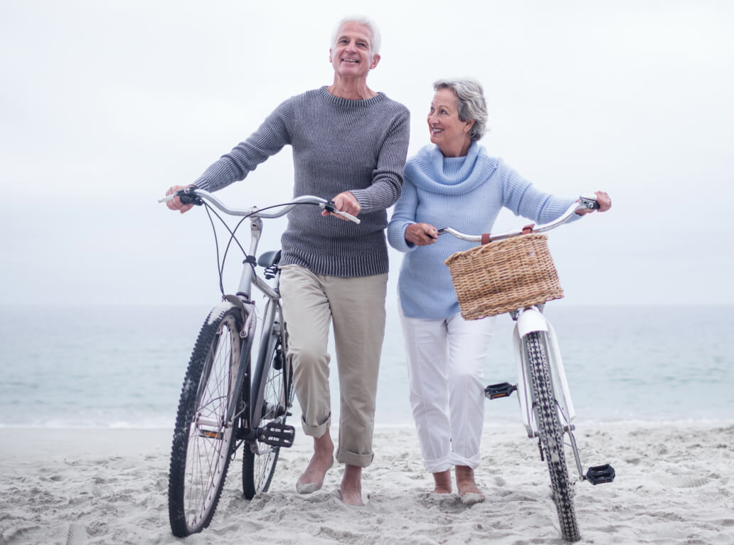 senior couple biking