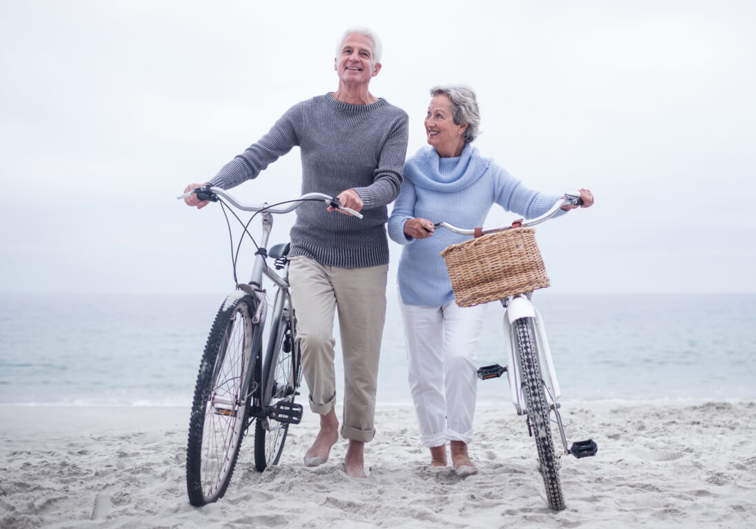 senior couple biking