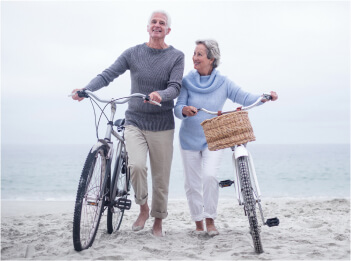 senior couple biking